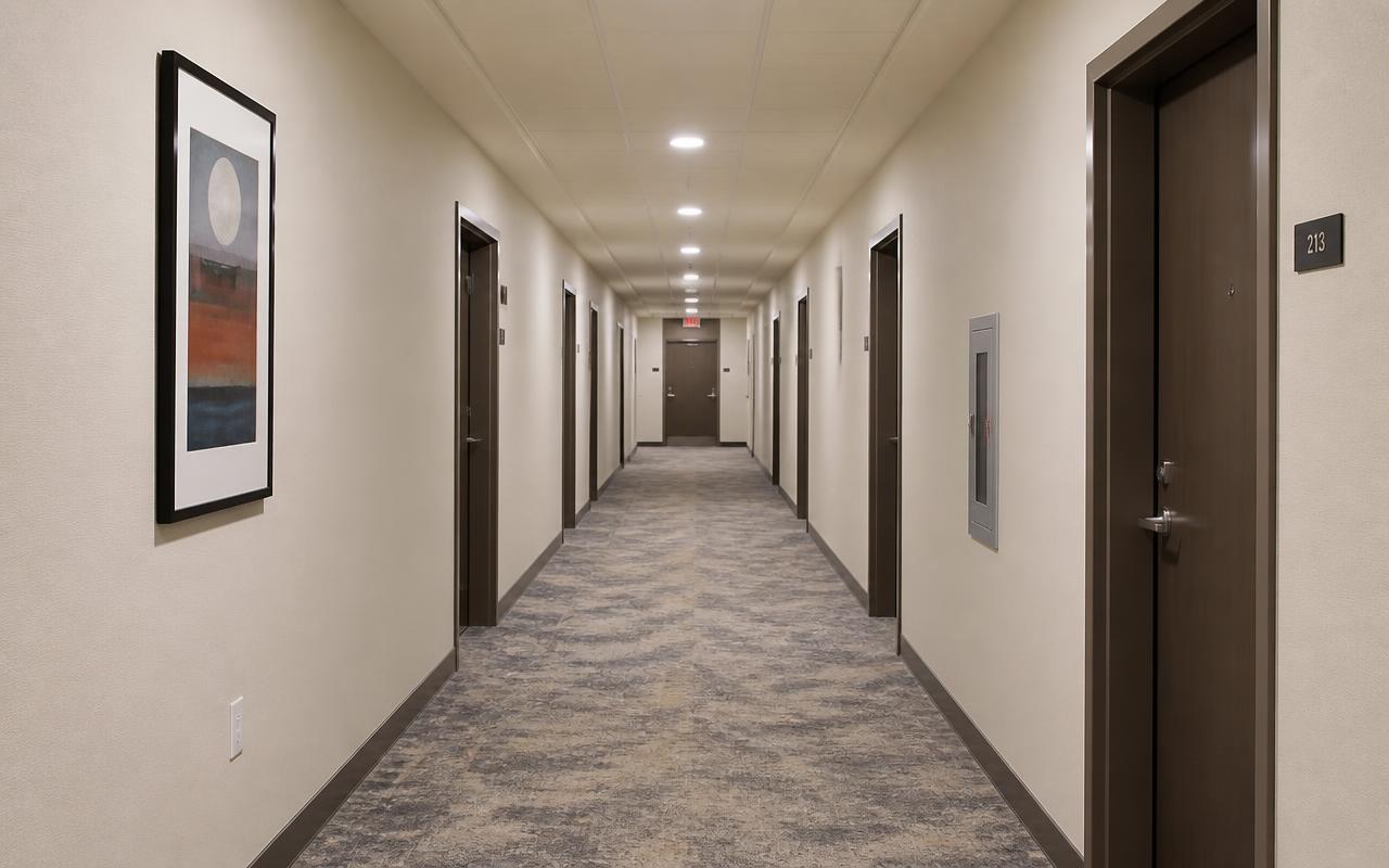 Discarded frame: an evenly lit hotel corridor with no shadow