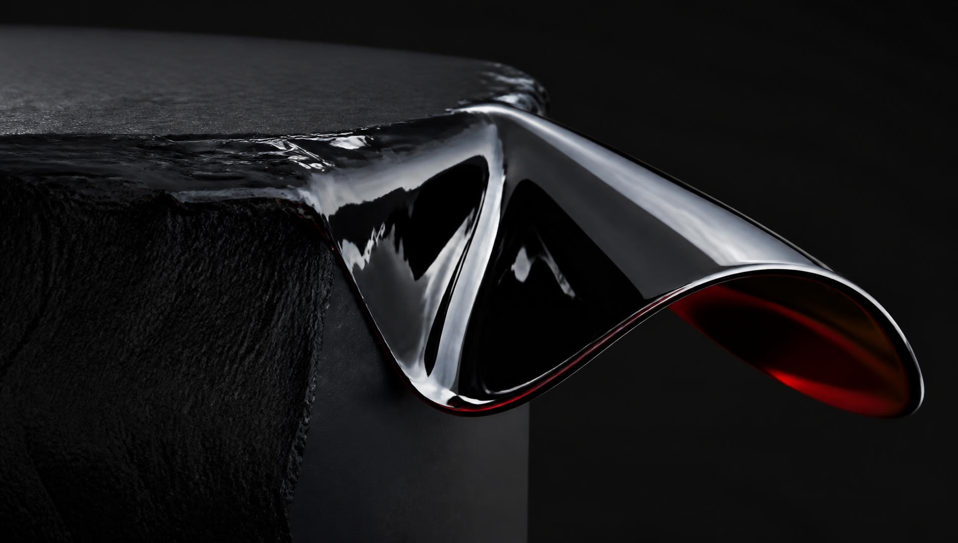A sheet of liquid chrome curling off a matte black block, oxide-red light under the fold