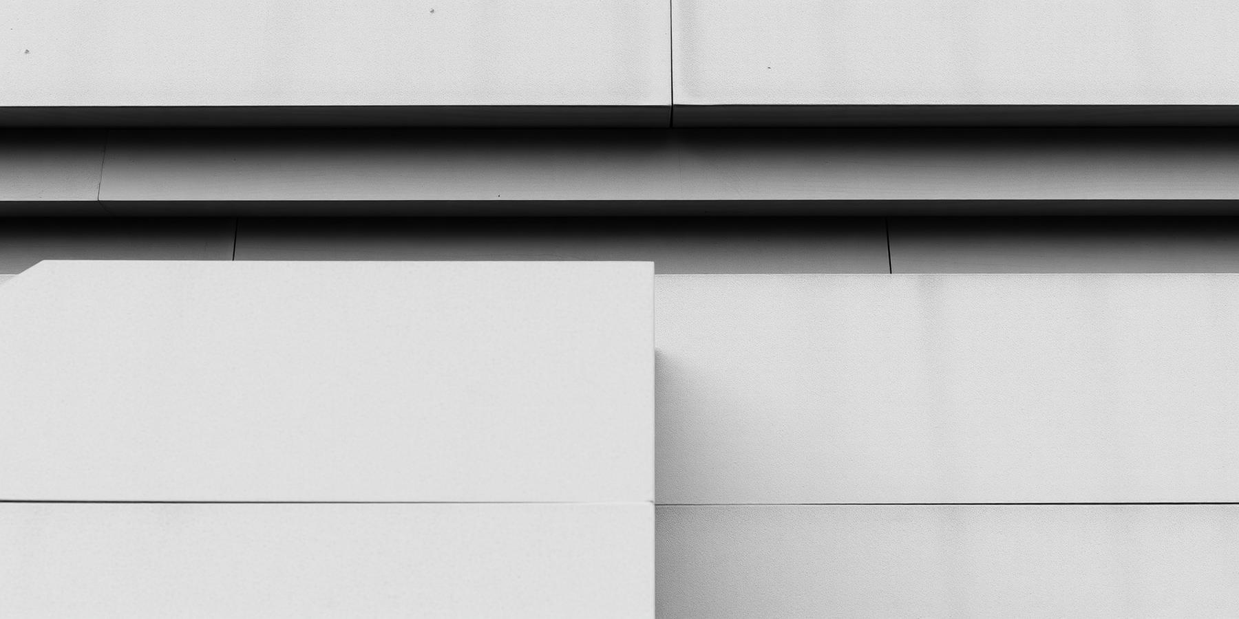 Layered architectural planes in flat daylight